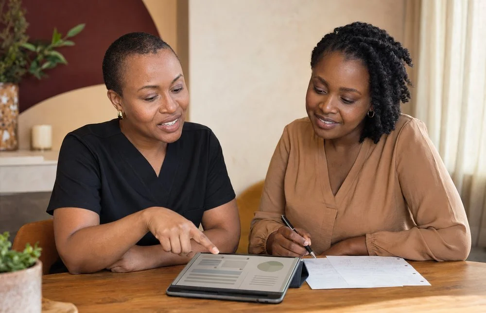 Illustrative image: a physical therapist talks a woman through a pelvic health plan on a tablet